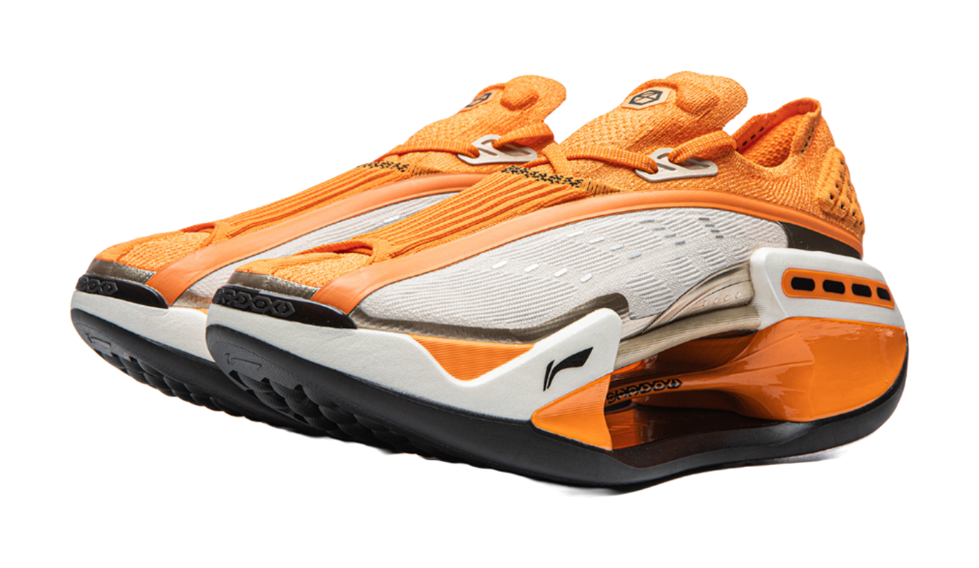 Orange Li-Ning Shadow running shoe angled view with white midsole and black tread outsole