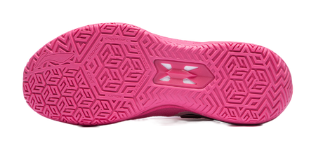 Pink basketball shoe outsole with geometric traction pattern and central support plate.