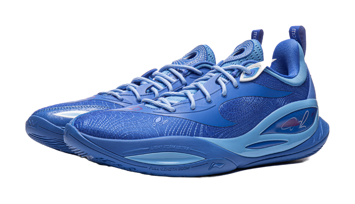 Blue basketball shoe with lace-up closure, side swoosh logo, and padded collar