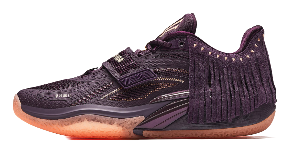 Purple basketball shoe with lace-up front, fringe collar, gold accents, textured rubber sole