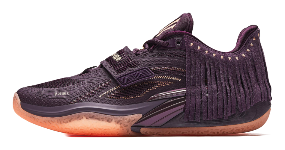 Purple basketball shoe with lace-up front, fringe collar, gold accents, textured rubber sole