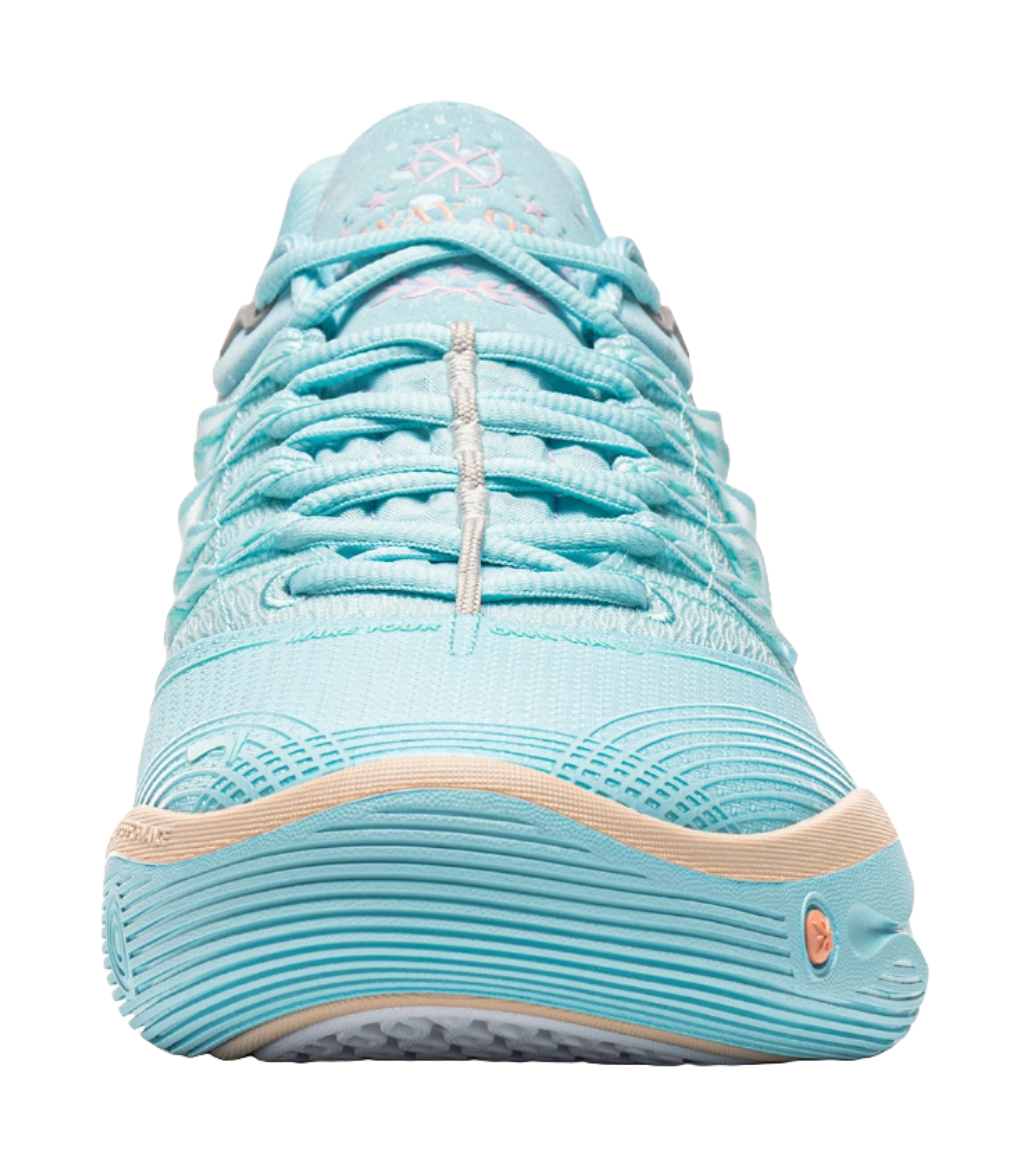 Light blue lace-up low basketball shoe toe view with breathable textured upper