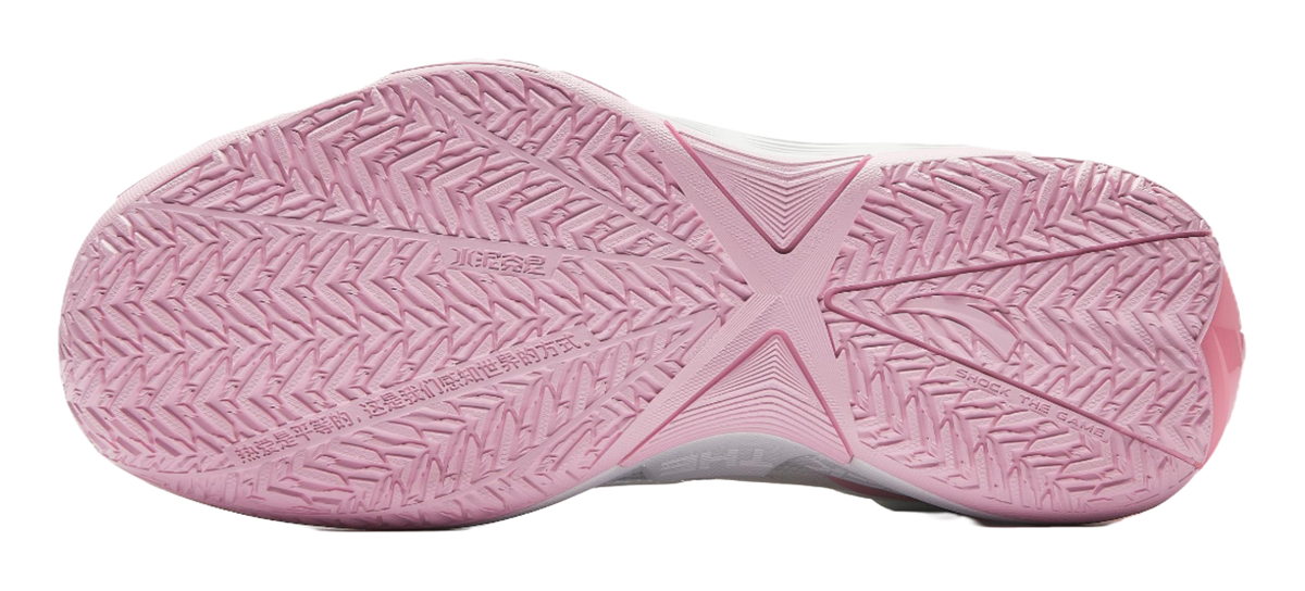 Pink and white basketball shoe outsole with textured grip pattern