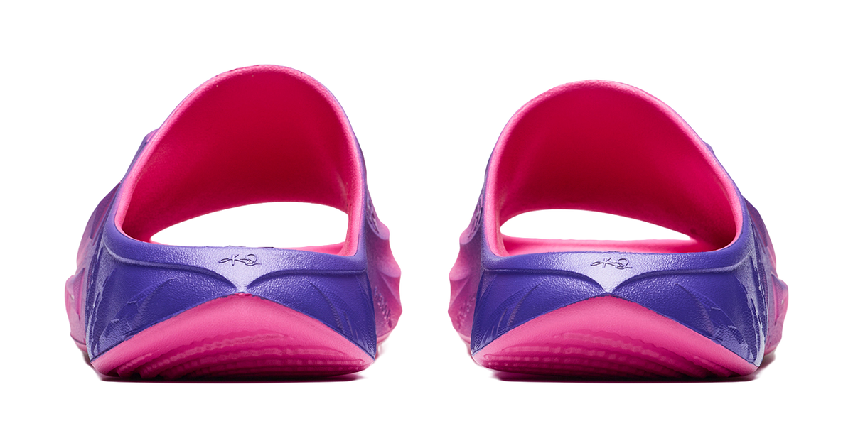 Unisex slide sandal heel view with purple back panel and pink open-heel lining