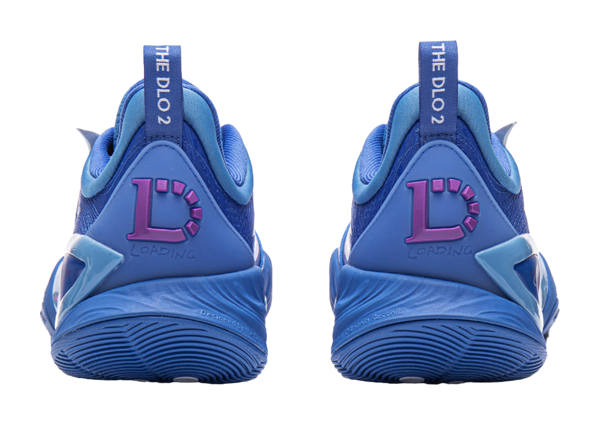 Blue basketball shoe heels with purple accent logo and cushioned back tab