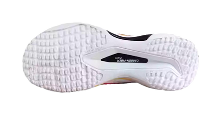 White badminton shoe outsole with textured tread and cushioned midsole