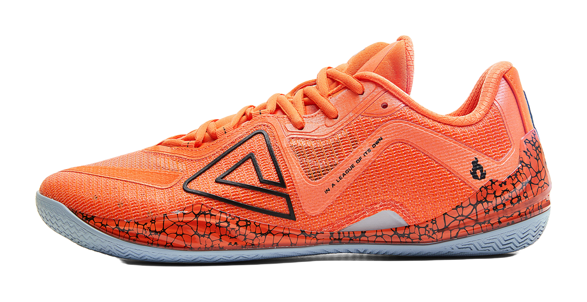 Orange basketball shoe with black logo and lava-style patterned side panels