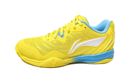 Yellow table tennis shoe with blue collar, white logo, and patterned upper