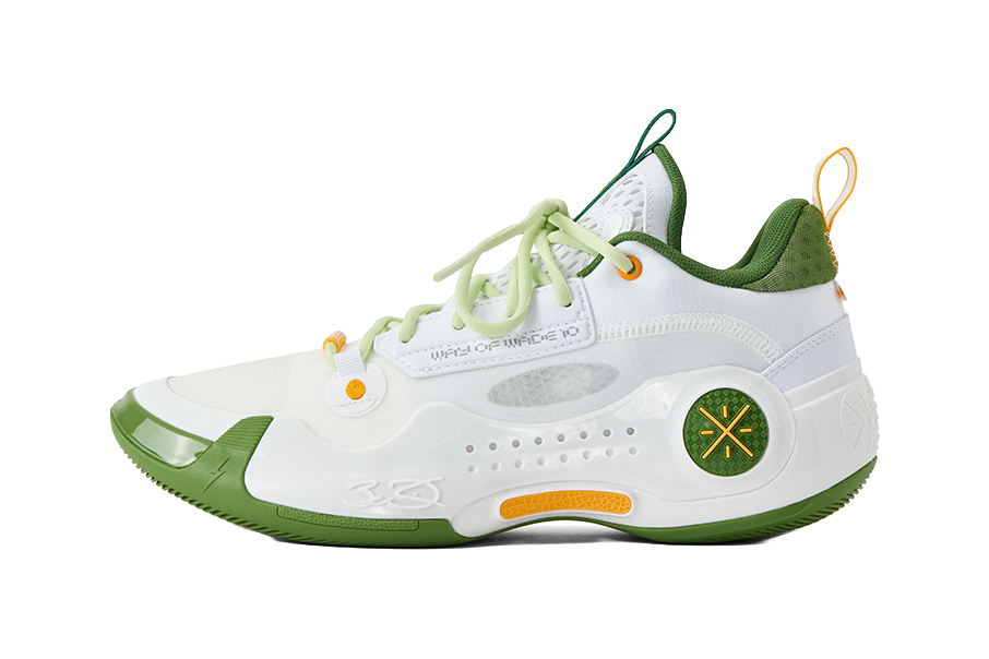 White and green low-top basketball shoes with neon laces and orange pull tabs.