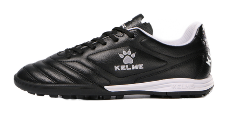 Black TF training soccer shoe with lace-up, KELME logo, and white midsole