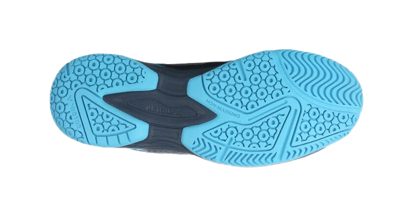 Badminton shoe outsole view with blue traction pattern and dark midsole edge.