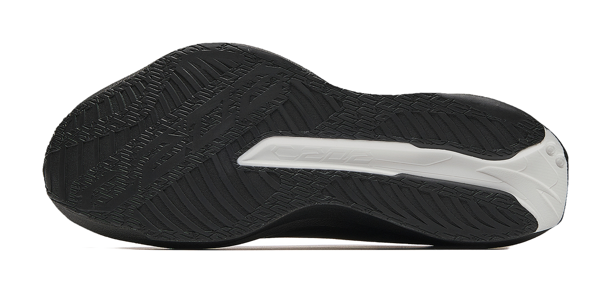Men's low-top running shoe outsole with black tread and white traction patch