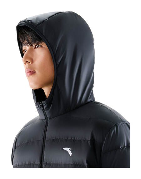 Black hooded puffer down jacket close-up of hood and chest logo