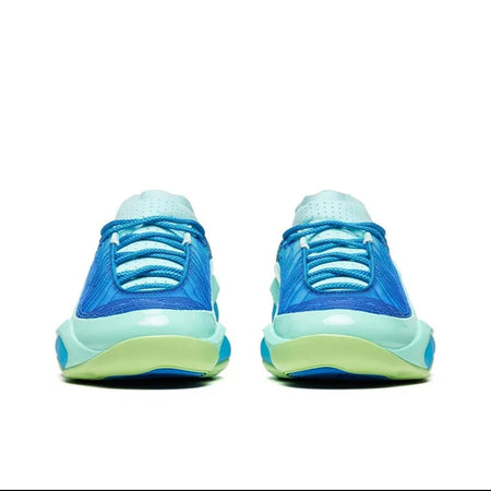 A pair of low-top athletic sneakers shown from the back, featuring a bright blue upper, light blue collar, and a thick translucent midsole that shifts from yellow-green to light blue. The image is presented on a white background within a mobile app screenshot.