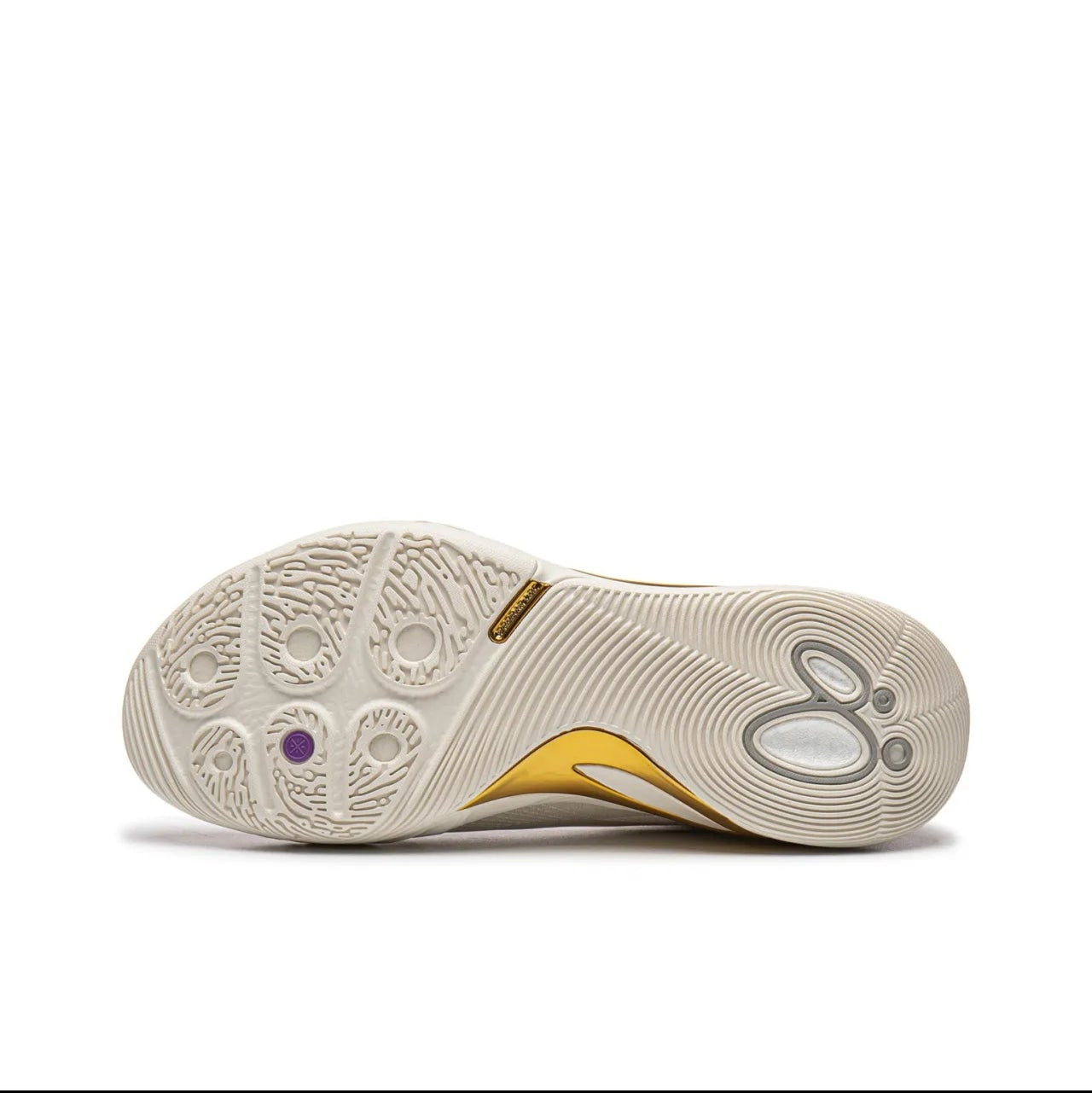 A close-up of a sneaker's outsole, showing a cream-colored rubber pattern with a small gold accent and a tiny purple detail, labeled as '白金' (which translates to platinum or white gold) on a white background.