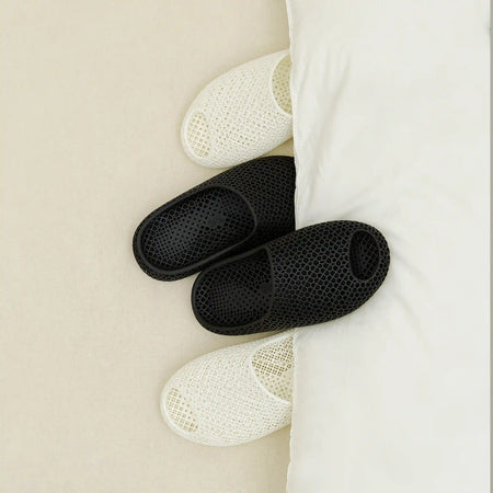 3D printed slippers, black and white open-toe slides with perforated knit uppers