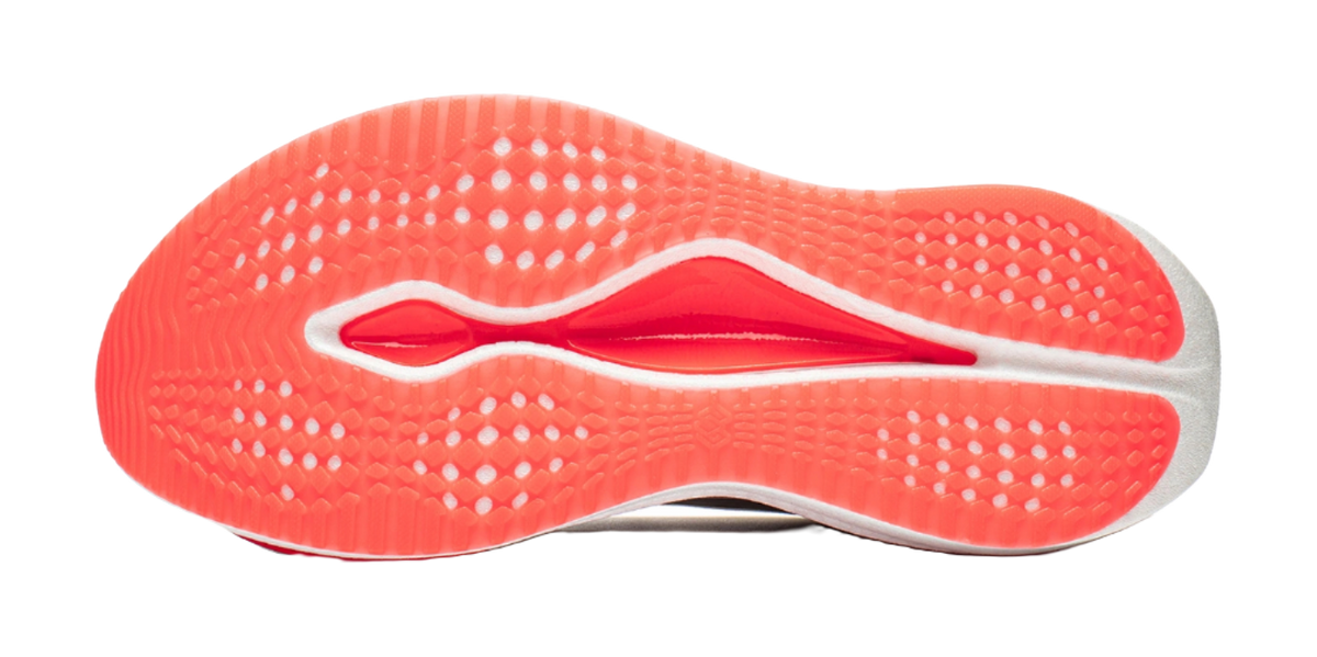 Shoe outsole with red-orange rubber tread and raised traction pattern