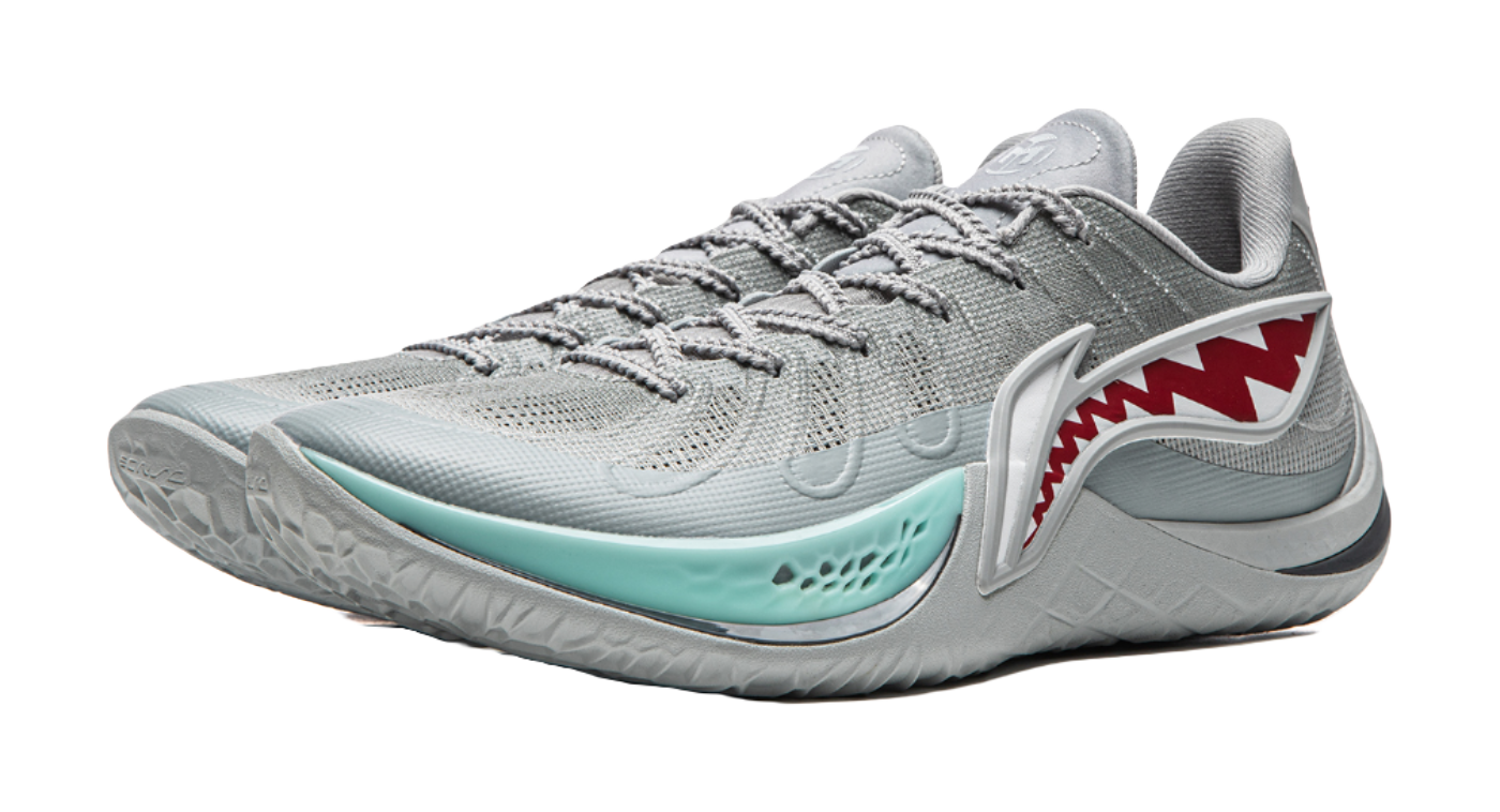 Gray basketball shoe with teal trim, red shark graphic, and laces