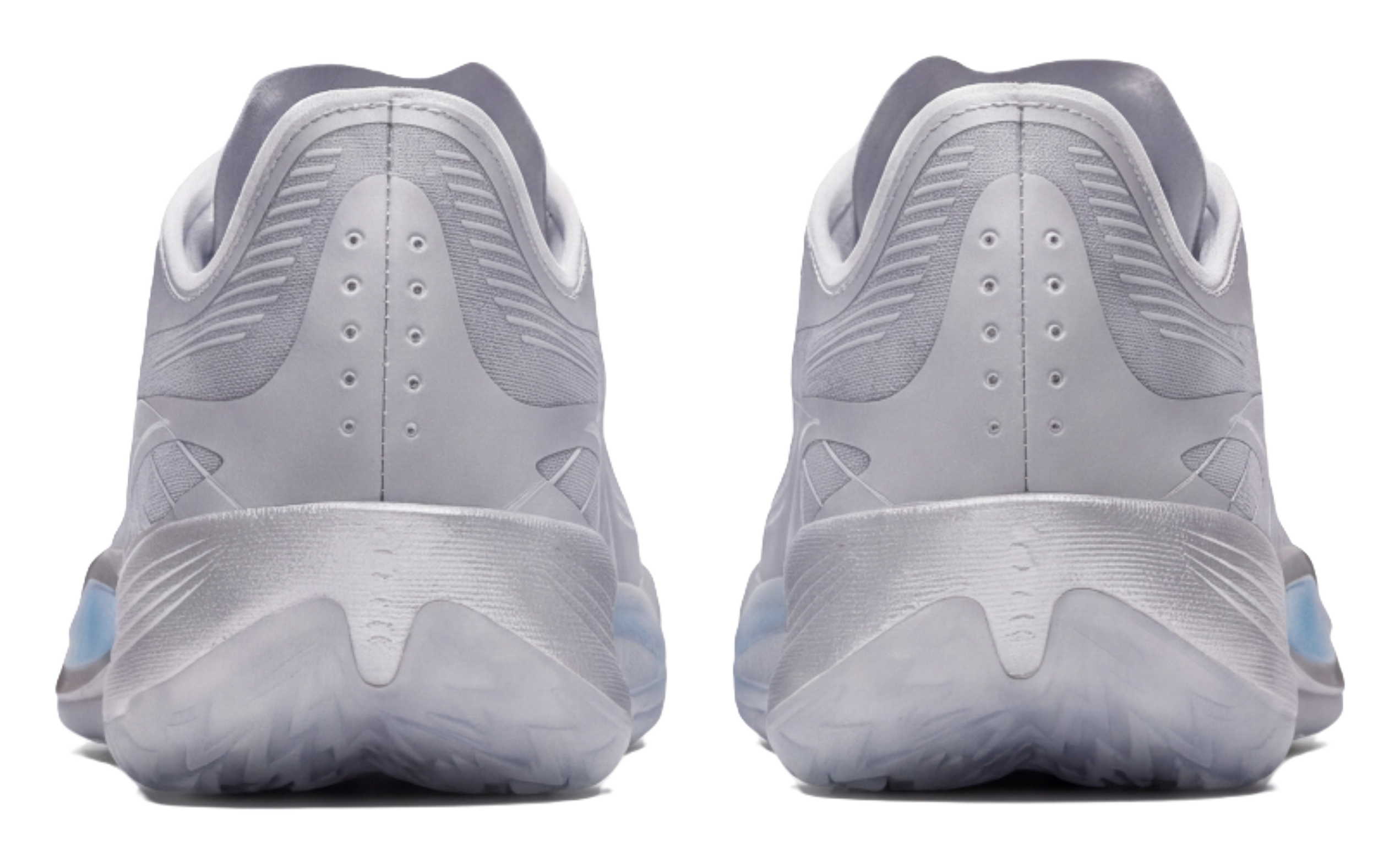 Silver low-top basketball shoes, back view, perforated heel and lace eyelets