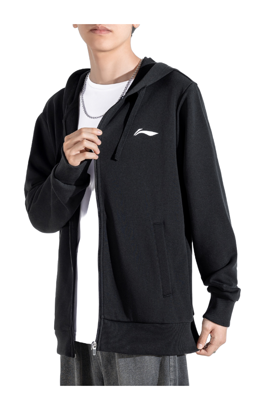 Men’s black zip-up hooded sweatshirt worn with front zipper and chest logo, drawstring hood