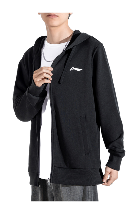 Men’s black zip-up hooded sweatshirt worn with front zipper and chest logo, drawstring hood