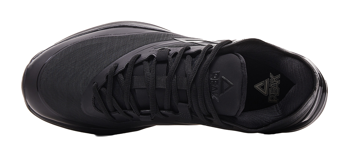 Black basketball shoe upper with lace-up system and high-ankle collar.