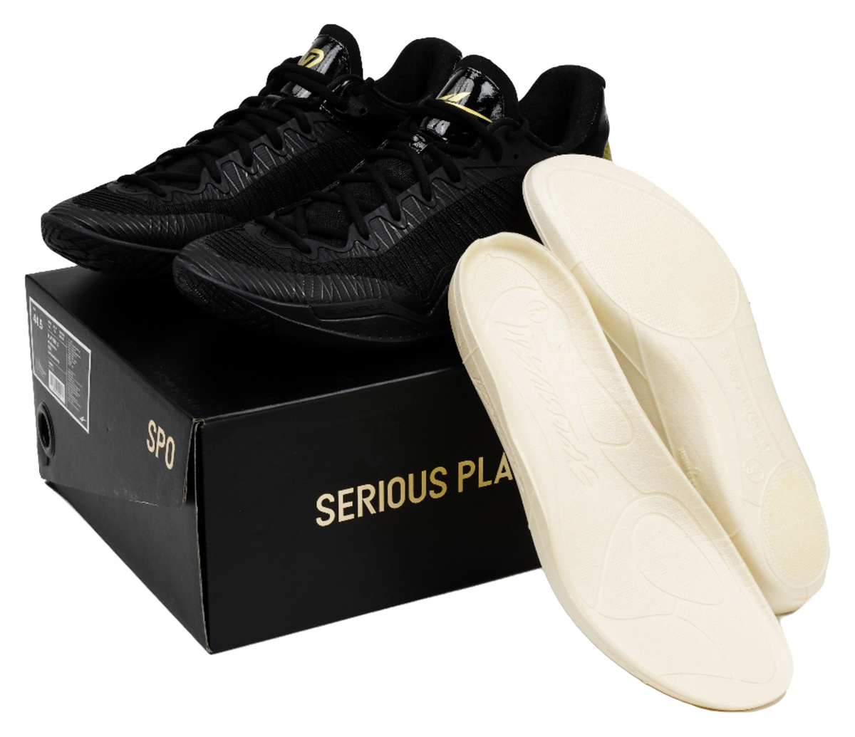 Black lace-up basketball shoes with beige insoles and box packaging shown