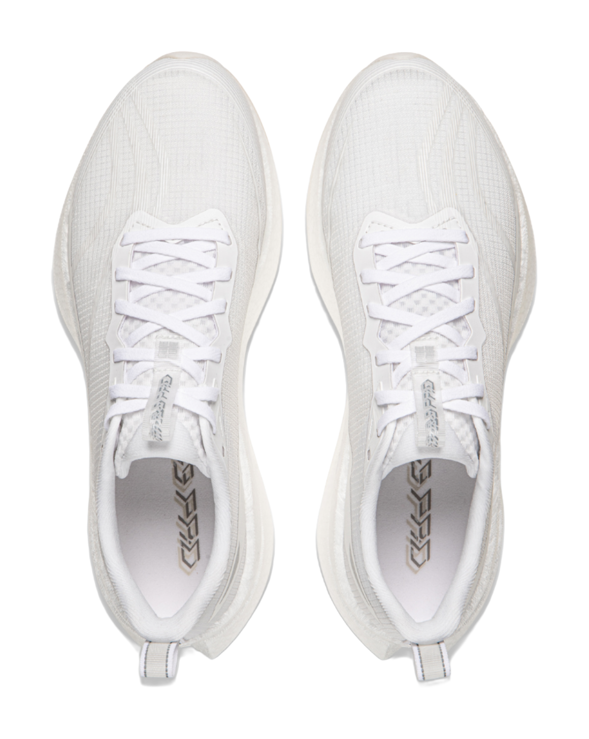 White running shoes, top view of pair showing lace-up tongues and mesh lining