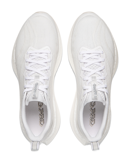 White running shoes, top view of pair showing lace-up tongues and mesh lining