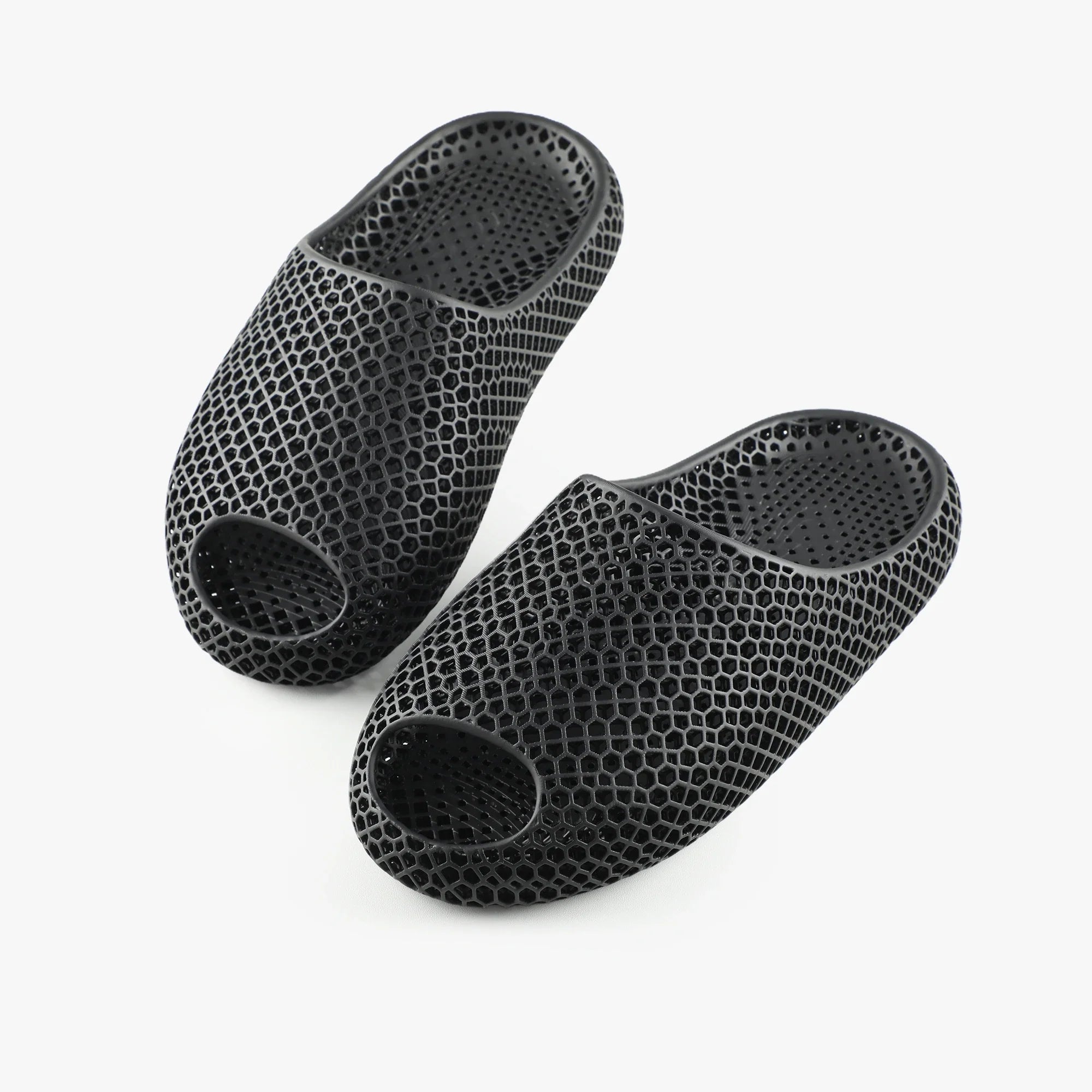 3D printed slippers, black pair with oval toe openings and textured footbed
