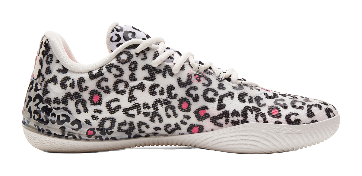 White low-top basketball shoe with leopard print upper and small pink accent marks