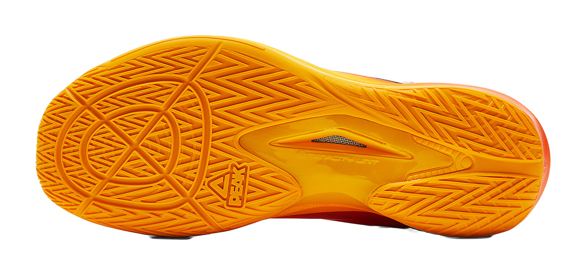 Basketball shoe outsole tread in bright yellow with PEAK emblem