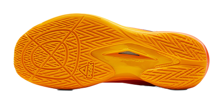 Basketball shoe outsole tread in bright yellow with PEAK emblem