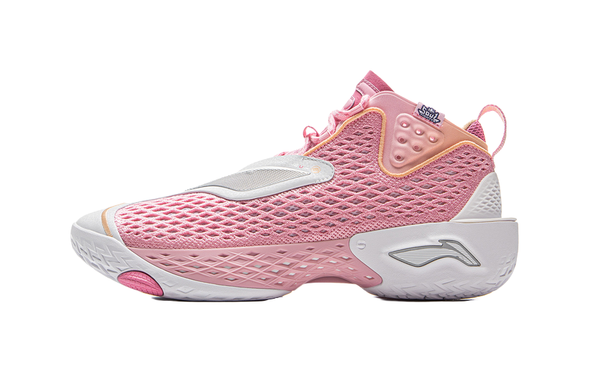 Pink basketball shoe with white sole and lace-up mesh upper