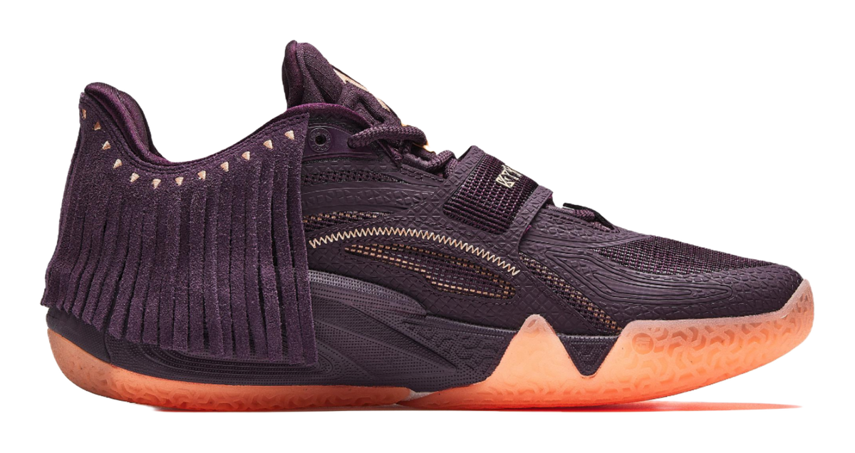 Purple basketball shoe side view, lace-up with patterned strap and fringe detail