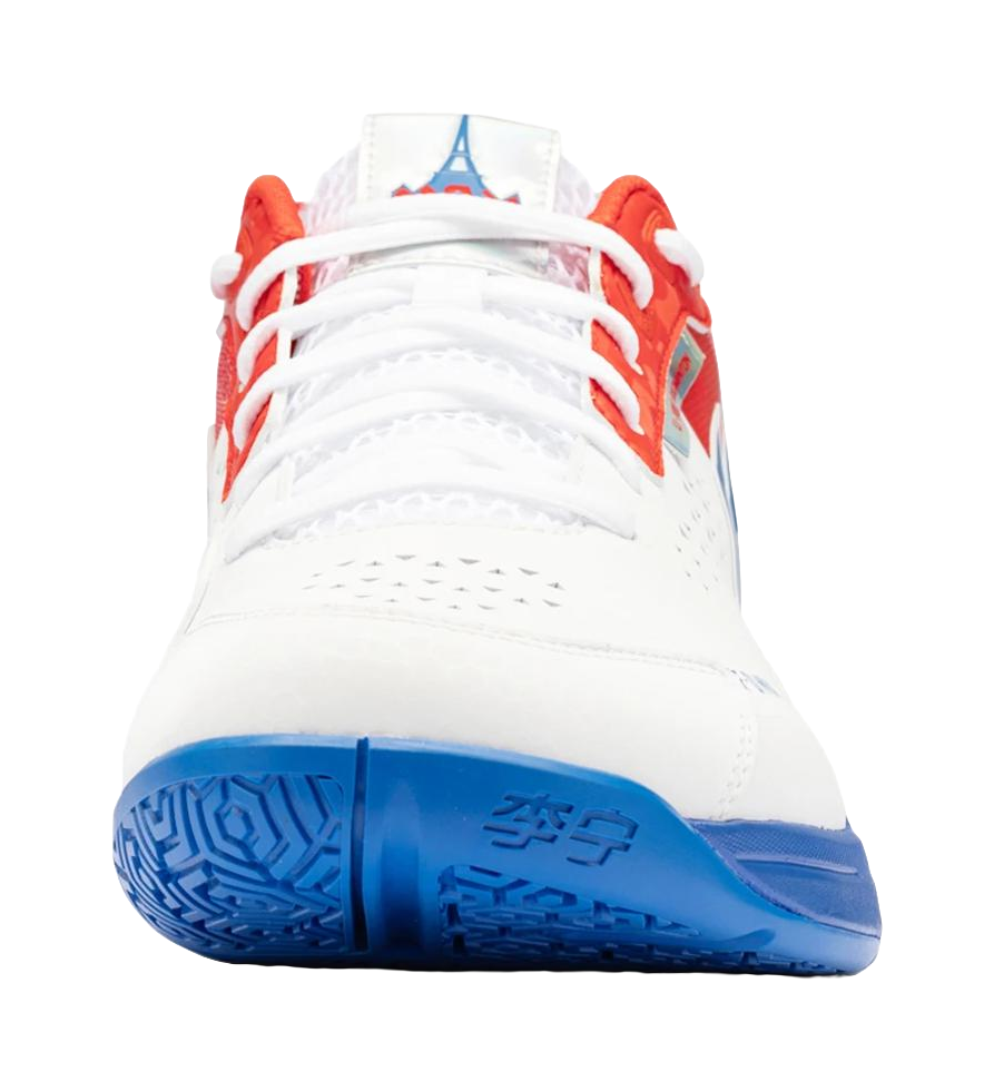 White unisex badminton shoe with red trim, white laces, and blue outsole