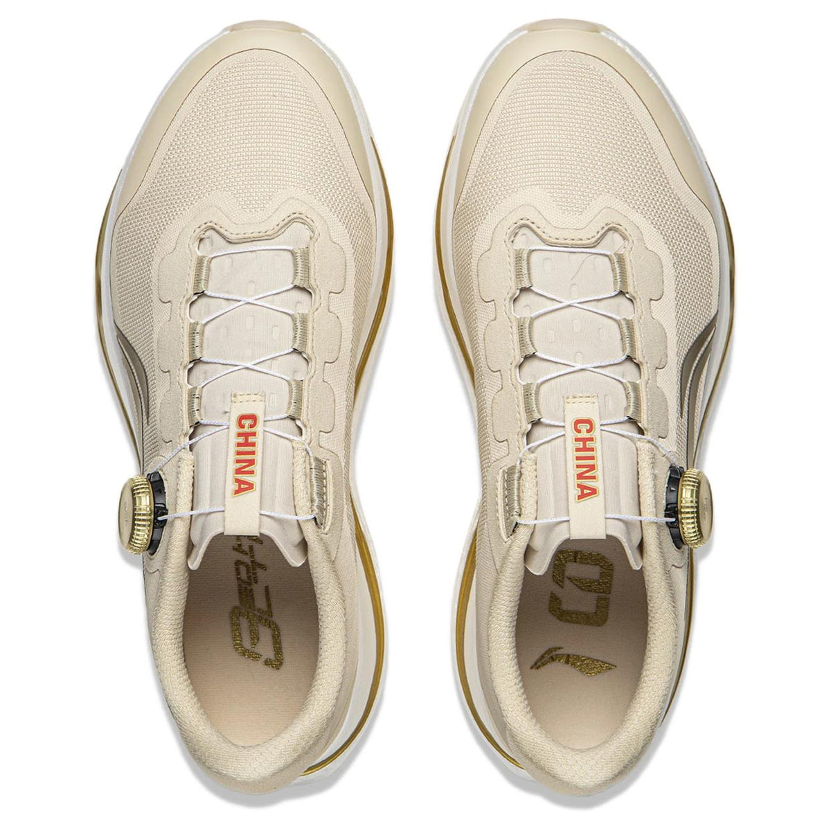 Pair of khaki running shoes showing lace area and CHINA tag inside tongue
