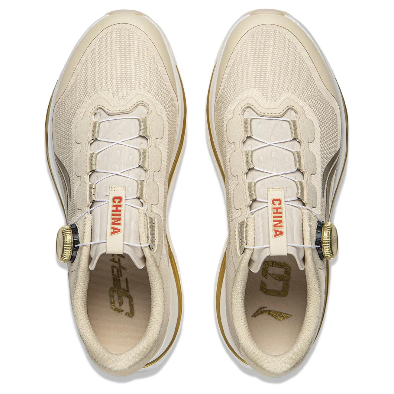 Pair of khaki running shoes showing lace area and CHINA tag inside tongue