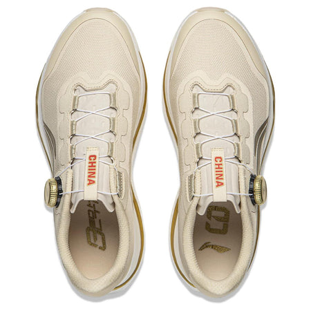 Pair of khaki running shoes showing lace area and CHINA tag inside tongue
