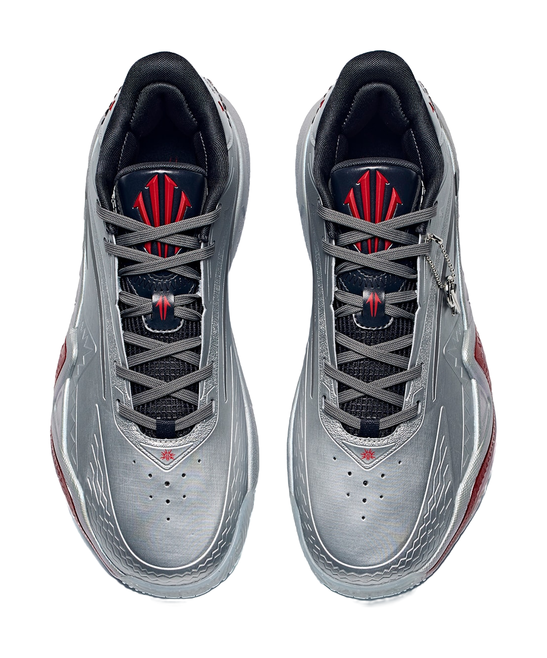 Pair of low basketball shoes in silver-gray with black laces and crimson/red logos