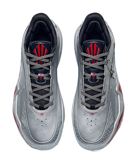 Pair of low basketball shoes in silver-gray with black laces and crimson/red logos