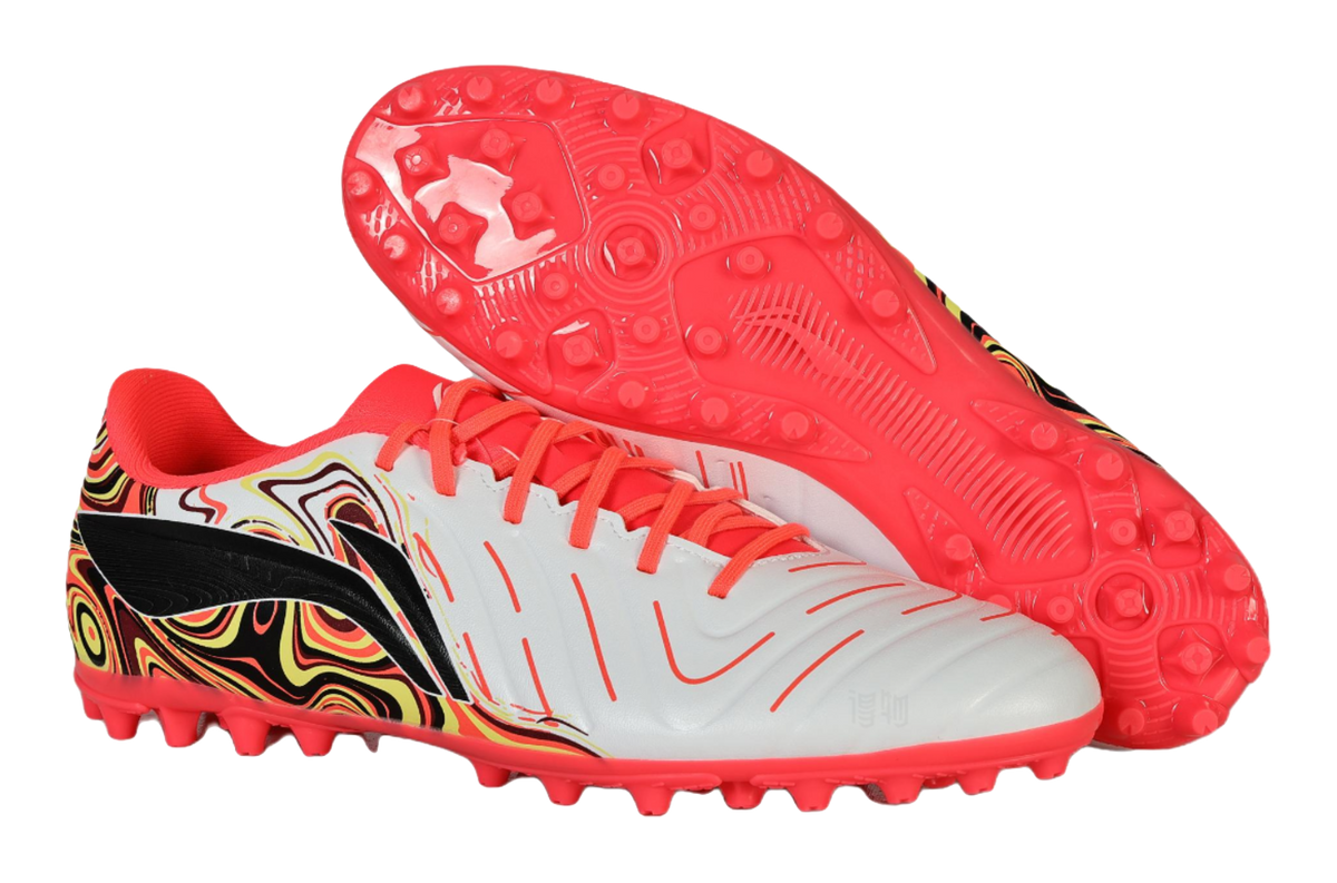 Unisex soccer shoe pair: white/red upper with swirl panel and red stud outsoles