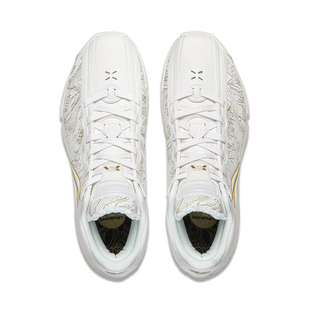 Pair of white basketball shoes, front view with lace system and patterned panels