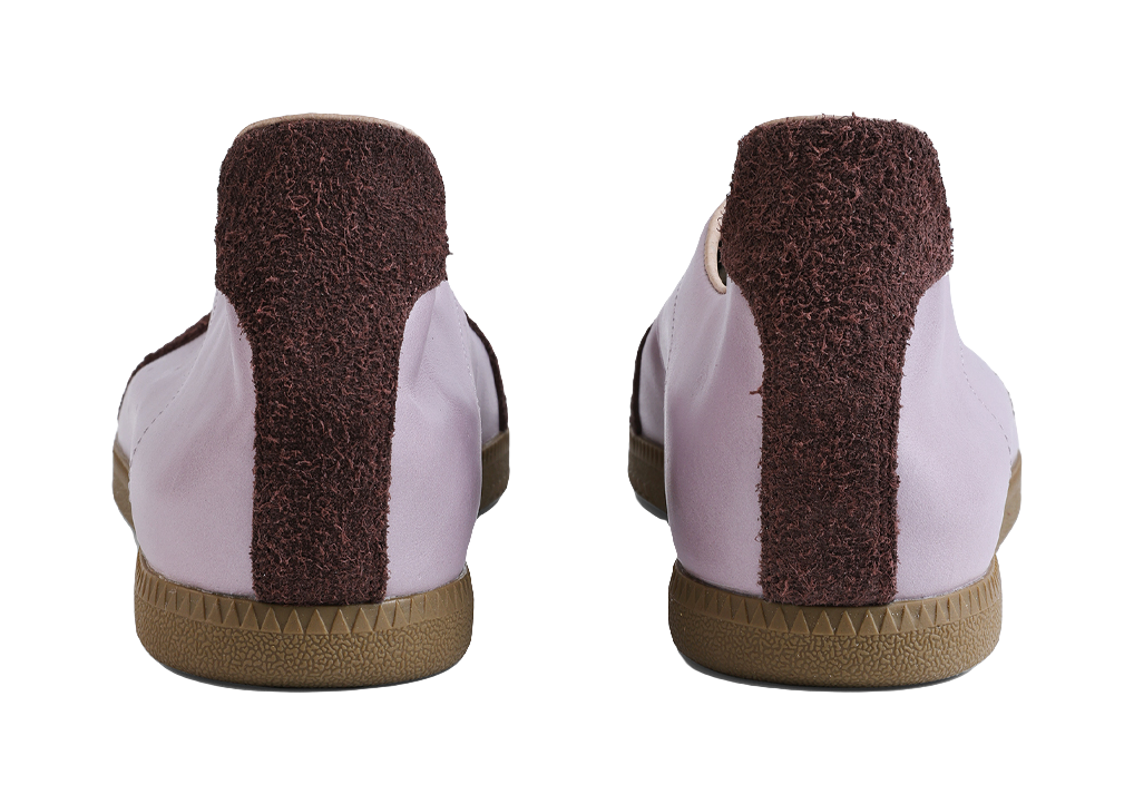 Rear view of lavender low-top shoes with dark brown heel panels and gum textured sole
