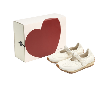 Women's white Mary Jane shoes with pearl strap and textured brown outsole