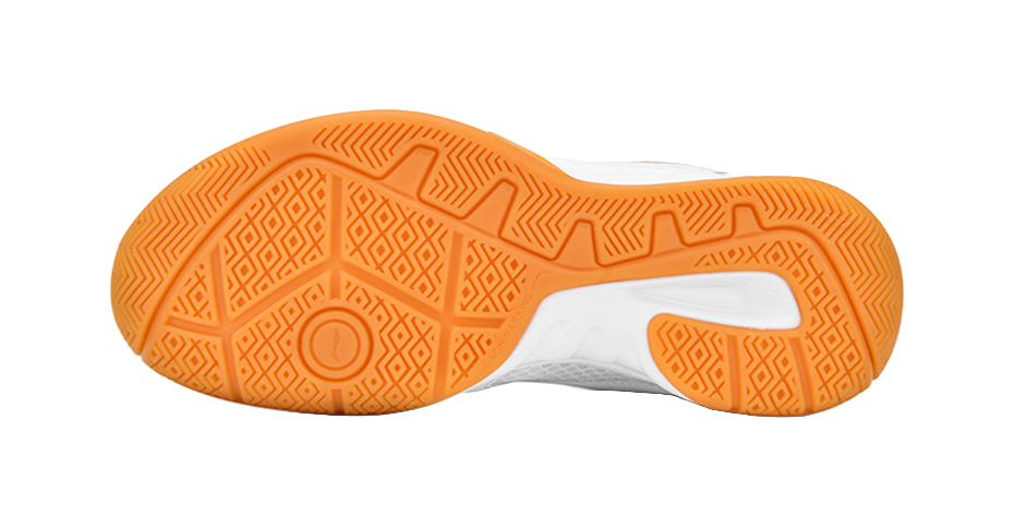 White-and-orange badminton shoe outsole with textured herringbone pattern