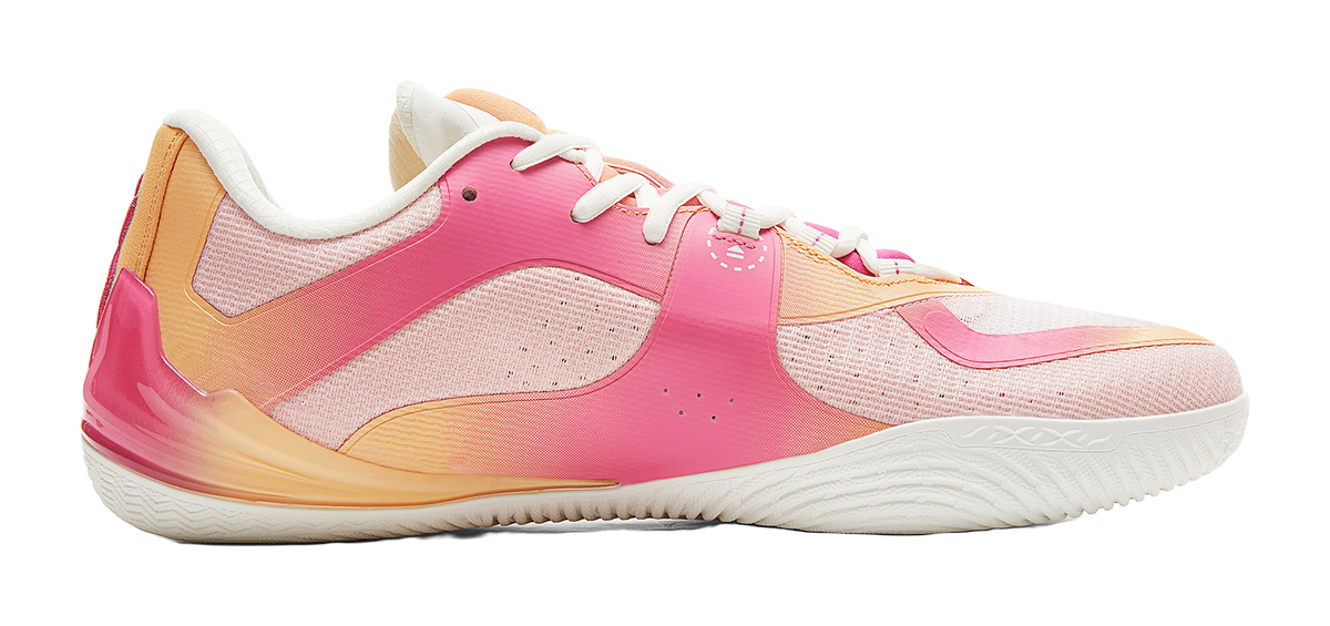 Pink basketball shoe side view, white laces, white sole, orange heel panel