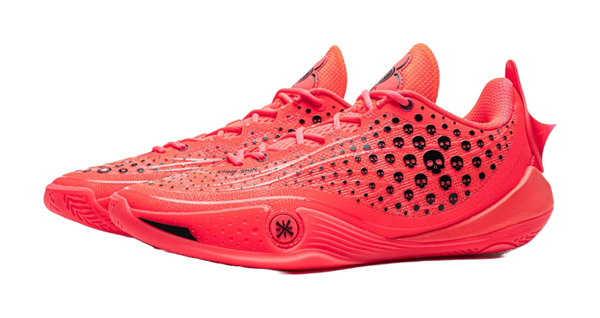 Fluorescent red lace-up basketball shoe with textured upper and heel logo