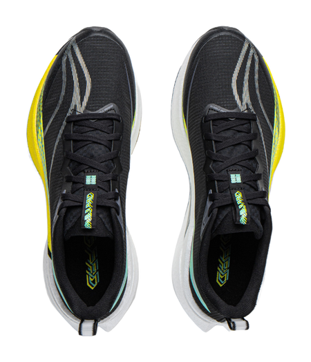 Unisex running shoe pair, black knit uppers with black laces, yellow edge trim, white sole