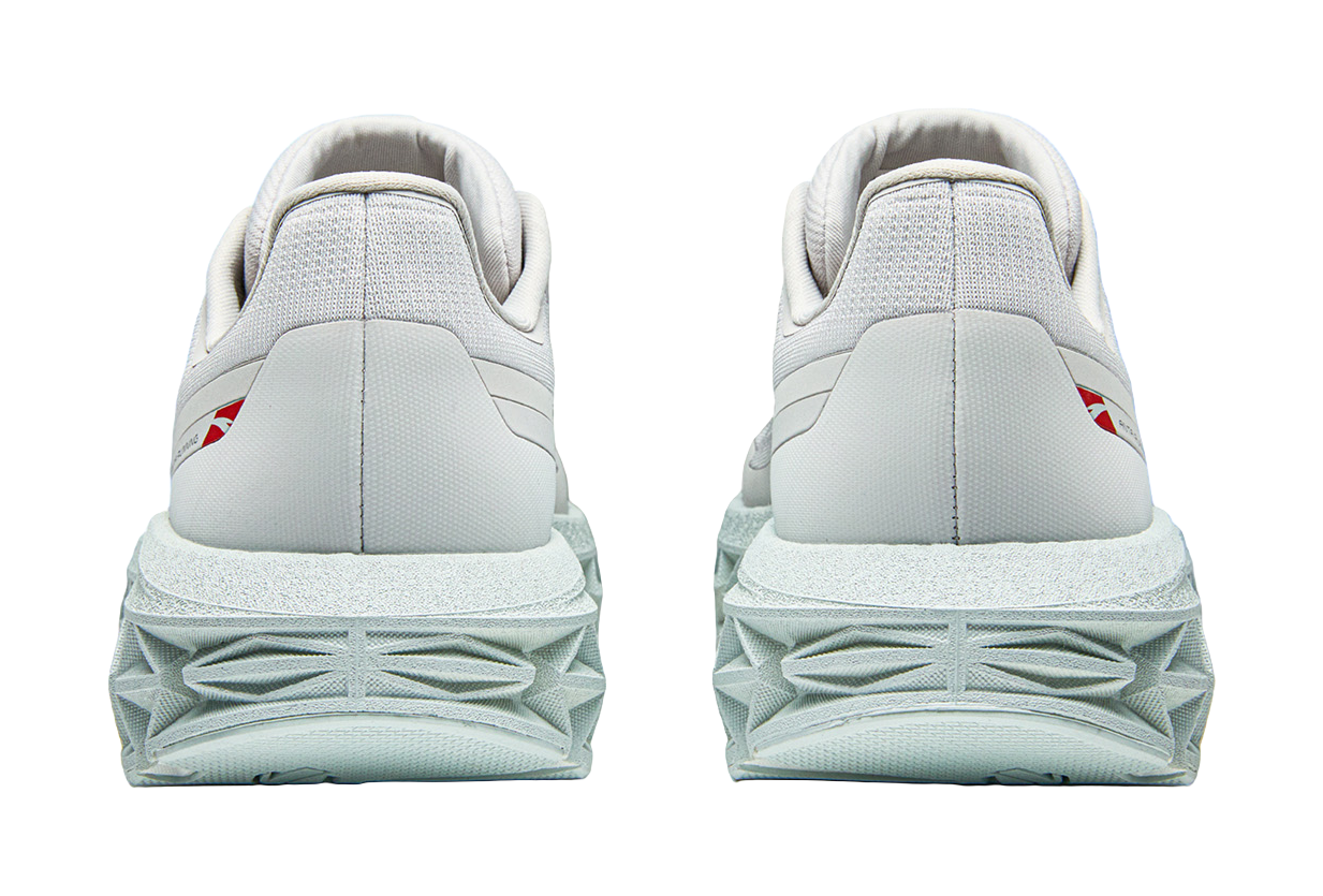 Pair of Anta low-top running shoes, light gray, rear view with cushioned heel and tread